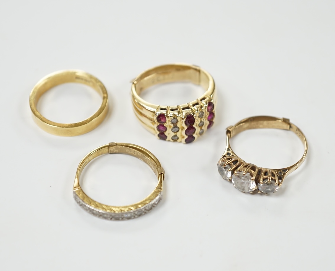 An 18ct and diamond chip set half hoop ring, size L/M, an 18ct gold band and two 9ct and gem set rings. Condition - fair